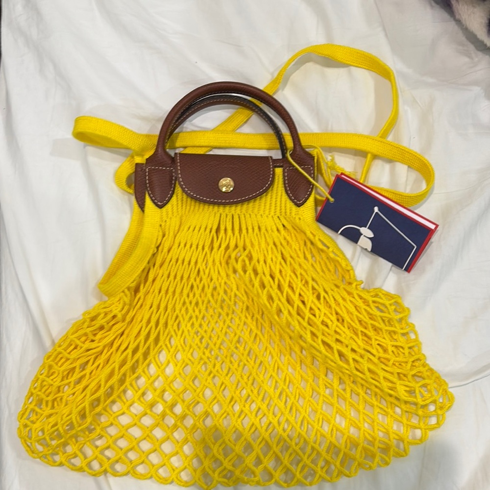 Authentic Yellow Longchamp yellow Le Pliage Filet Bag featured in Emily in Paris